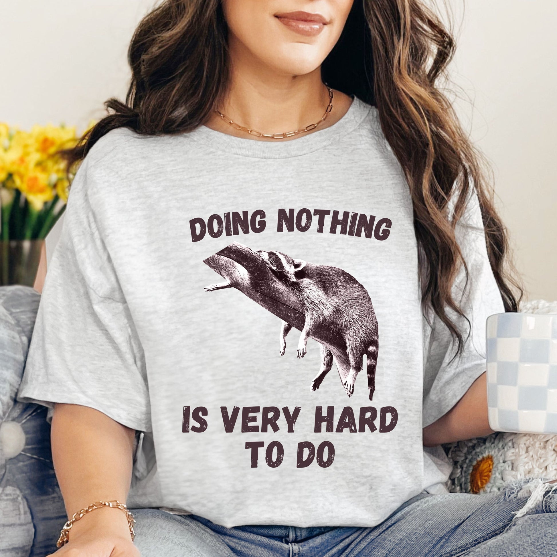 Cute Raccoon Graphic Tee – 'Doing Nothing Is Very Hard to Do' – Funny Unisex T-Shirt-Ash-Family-Gift-Planet